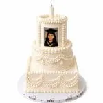 White graduation cake with the photo frame