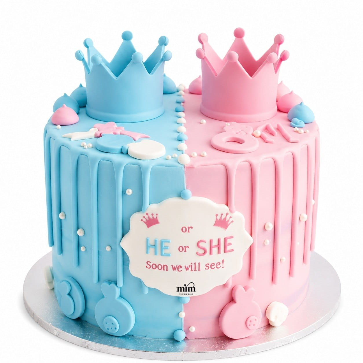 He or She Gender Reveal Cake 💙🩷 A stylish gender reveal cake featuring a split blue and pink design, elegant crown toppers, baby-themed details, and a “He or She” message for a fun and memorable celebration. 700 He or She Gender Reveal Cake 💙🩷 - Image 1
